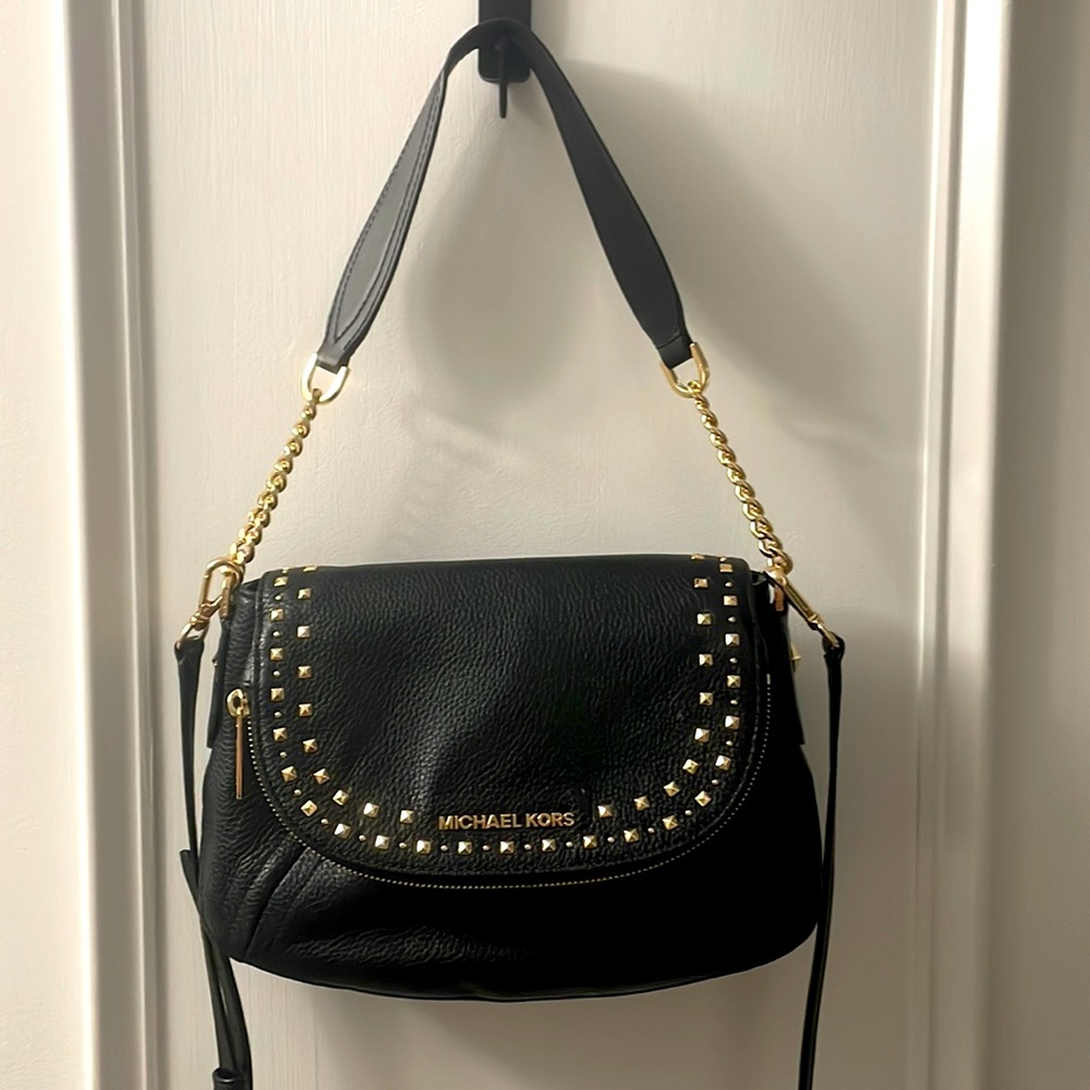 Michael kors purse. Double straps and adjustable. Black leather & gold hardware.